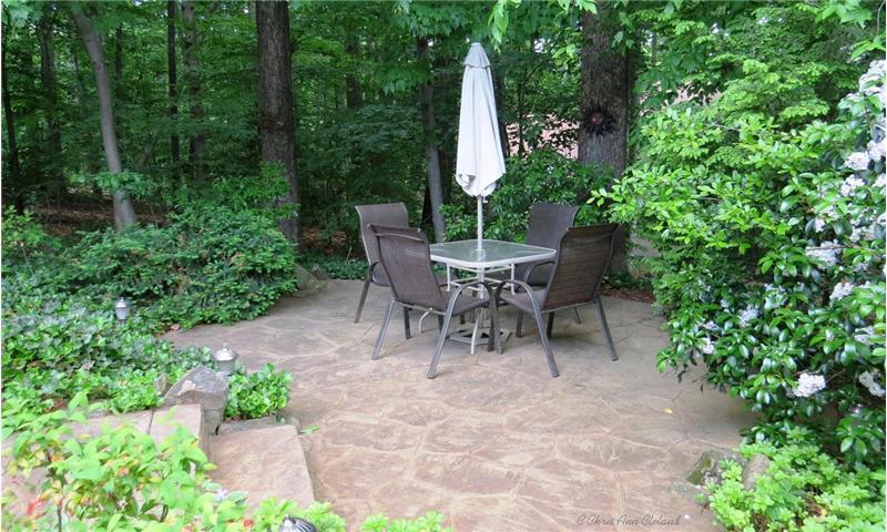 Stamped Concrete Patio feels nestled in woods