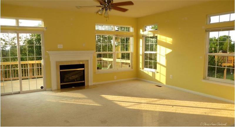 Family Room is surrounded by Transom Accented Windows