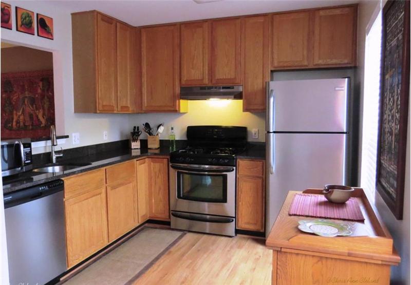 Kitchen has Granite Counters & Stainless Steel Appliances
