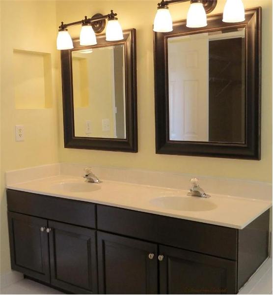 Master Bathroom has Updated Vanity, Mirrors and Light Fixtures