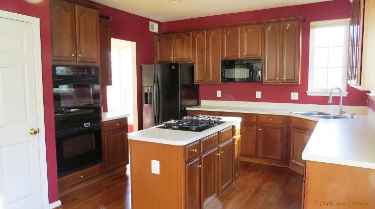 Kitchen has Wall Oven and opens to Formal Dining Room